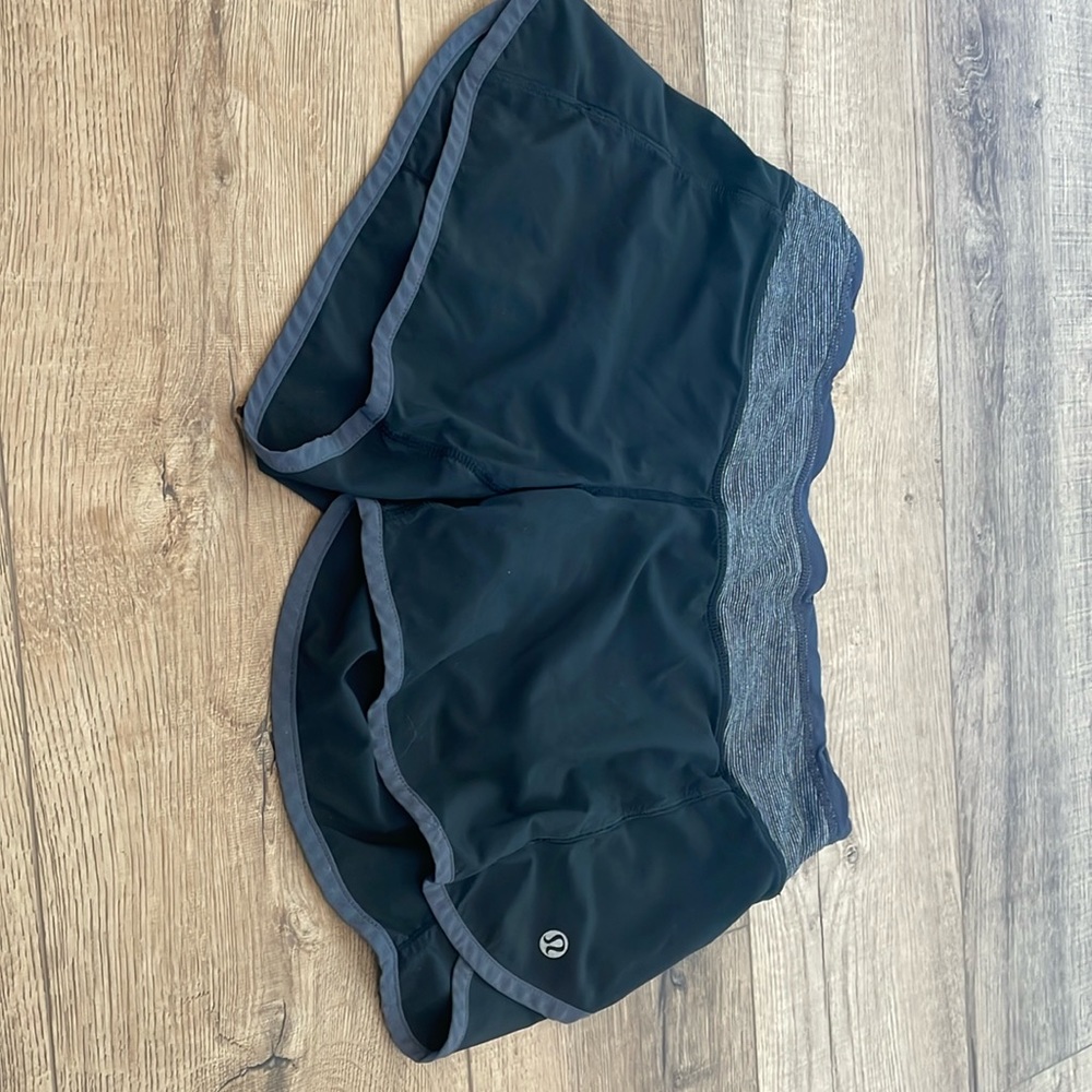 Lululemon size 4, black 4 inch speed up shorts.